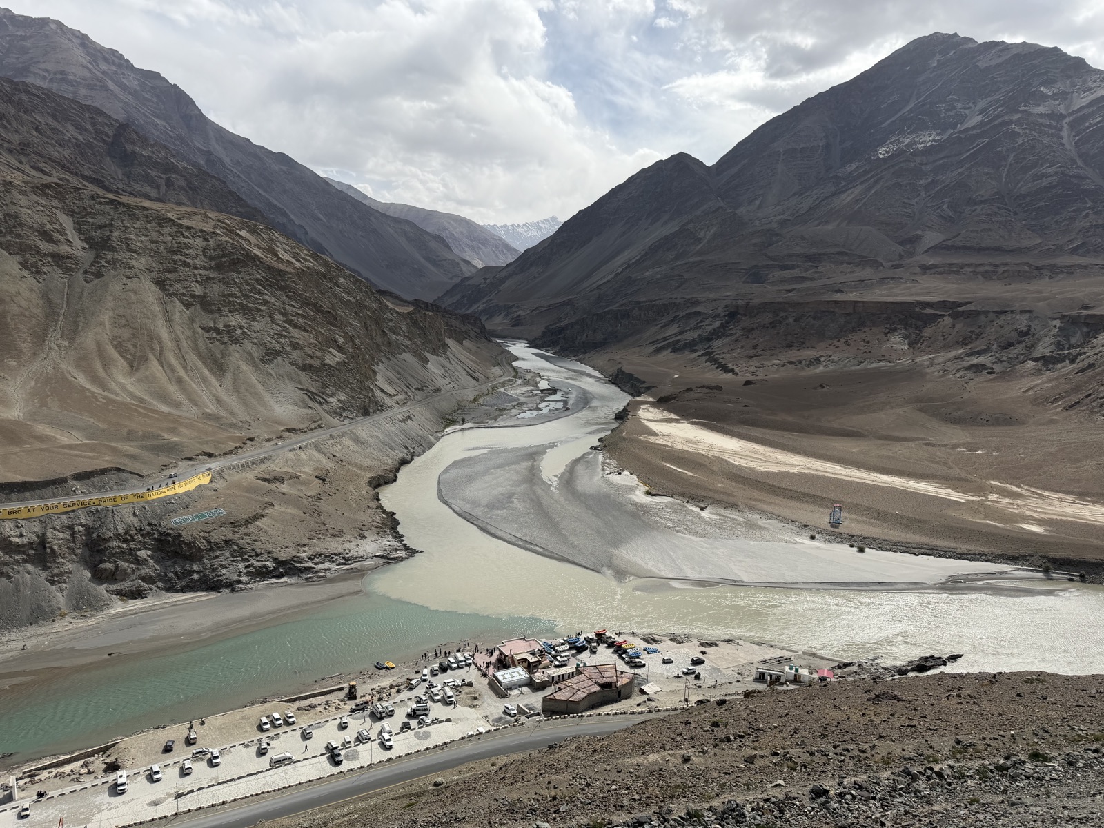 The confluence of the Indus and Zanskar rivers at Sangam — turquoise Zanskar meeting the brown Indus far below